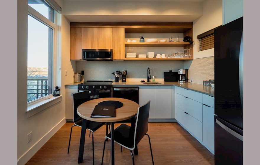 Ironworks 418 fully furnished kitchen and dining area with window Victoria